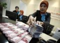 Rupiah Melemah, OJK Pastikan Tidak Ada Penarikan Dana Massal di Bank